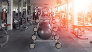 A gym with many machines and equipment in it