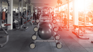 A gym with many machines and equipment in it