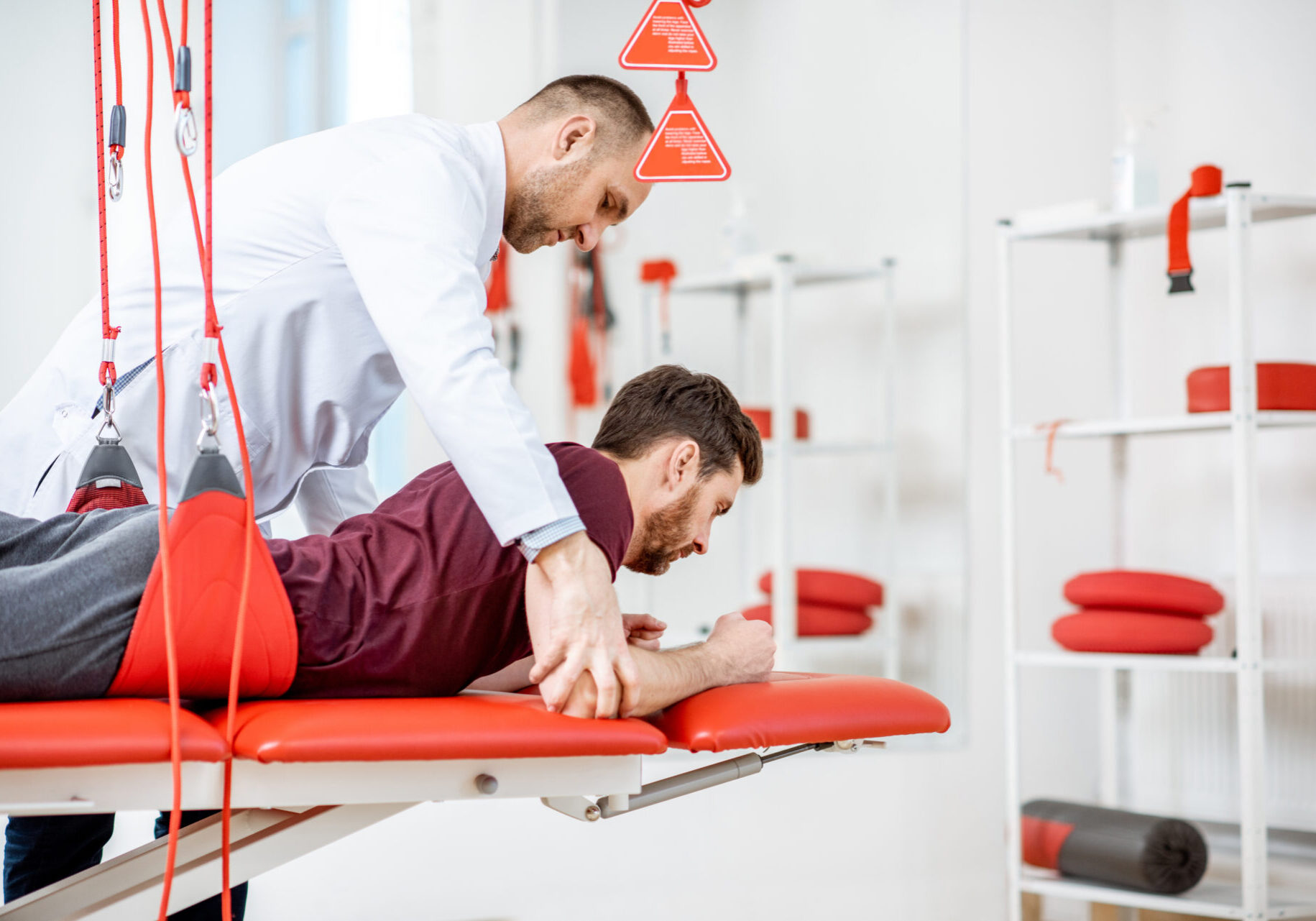 A man is being examined by an occupational therapist.